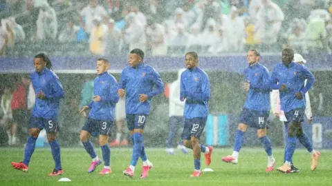 France players warm up ahead of their group stage match, as taken from BBC Sport